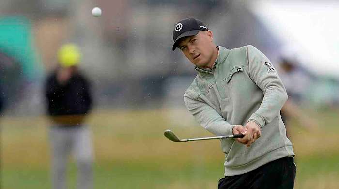 Jordan Spieth chips during a practice round for the 2023 British Open.